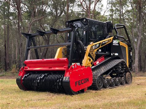 brush clearing with a skid steer|tree grinder for skid steer.